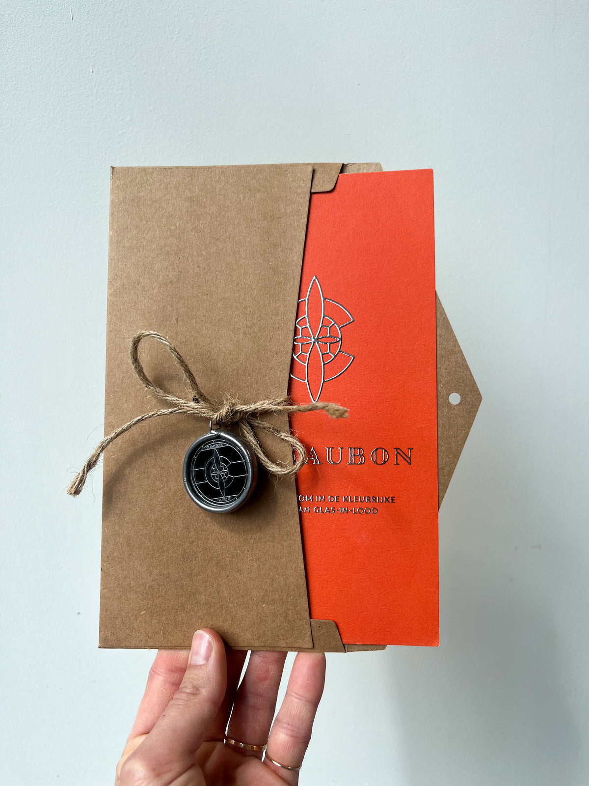 My orange gift voucher in kraft packaging with twine and a wax seal
